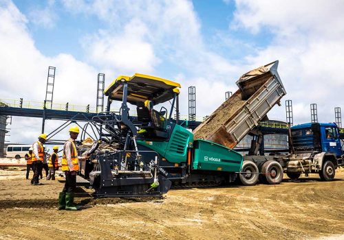 Road paving equipment and site team on Still Earth's Dangote Priority Road project